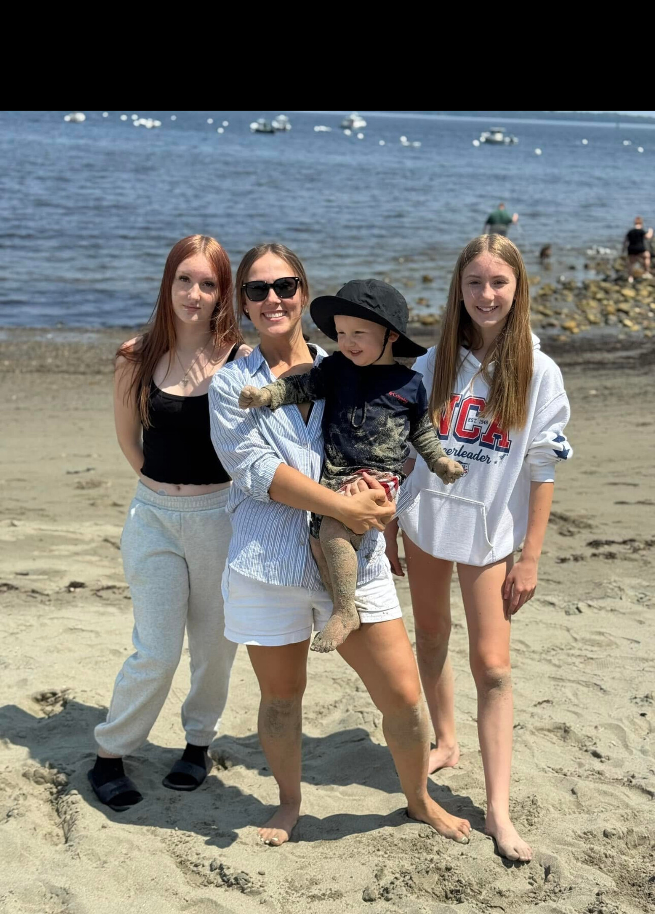 Brittany with daughters Izabella and Allison and son Dawson at the beach — the real Hatch family behind OneBella